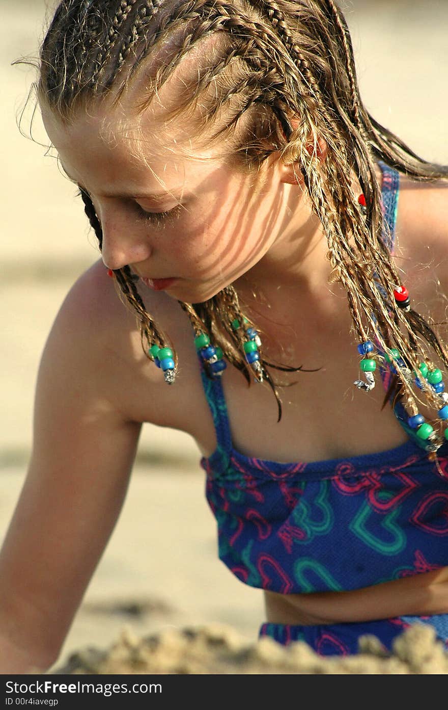 Girl Playing In The Sand