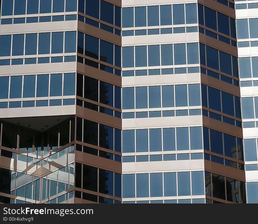 Stair step architecture and reflections in an urban high rise. Stair step architecture and reflections in an urban high rise.