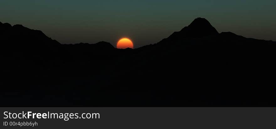 An image of some mountains, with sky in the background. An image of some mountains, with sky in the background.