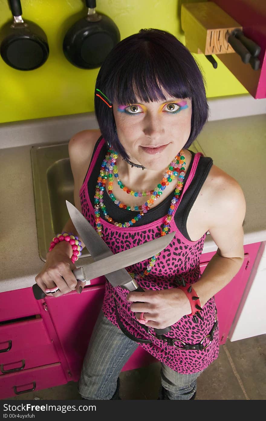 Punk woman in a colorful kitchen