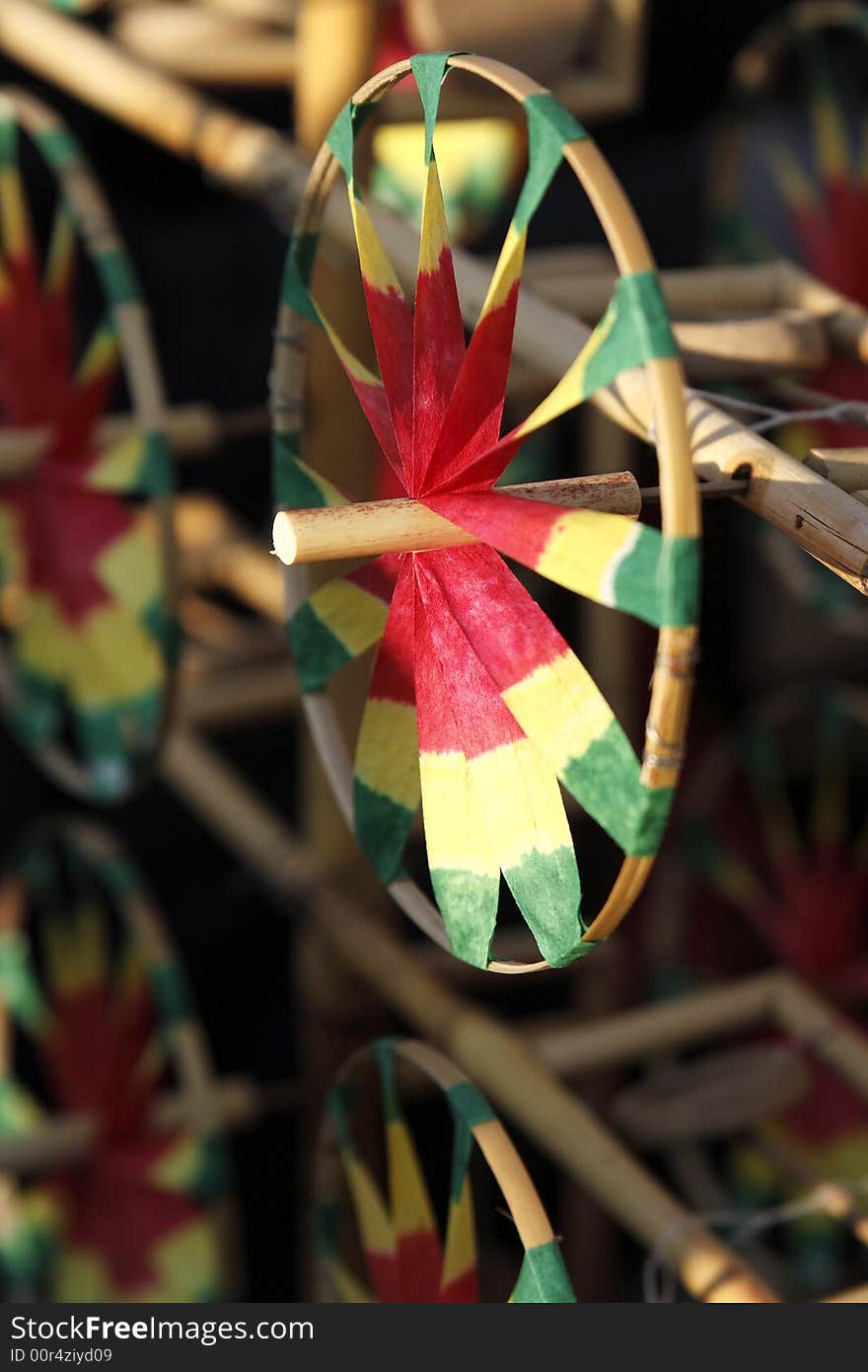 The windmill of Beijing is a characteristic at the temple fair in New Year. Its history can trace back to Qing Dynasty. Young people and children like it most. Under the blowing of wind, the windmill emits the wonderful sound while rotating. 

This picture lets you see some structure of the windmill of Beijing.