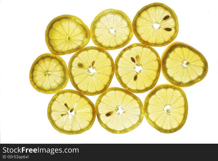 Lemon slices, backlit, stacked on top of each other. Lemon slices, backlit, stacked on top of each other