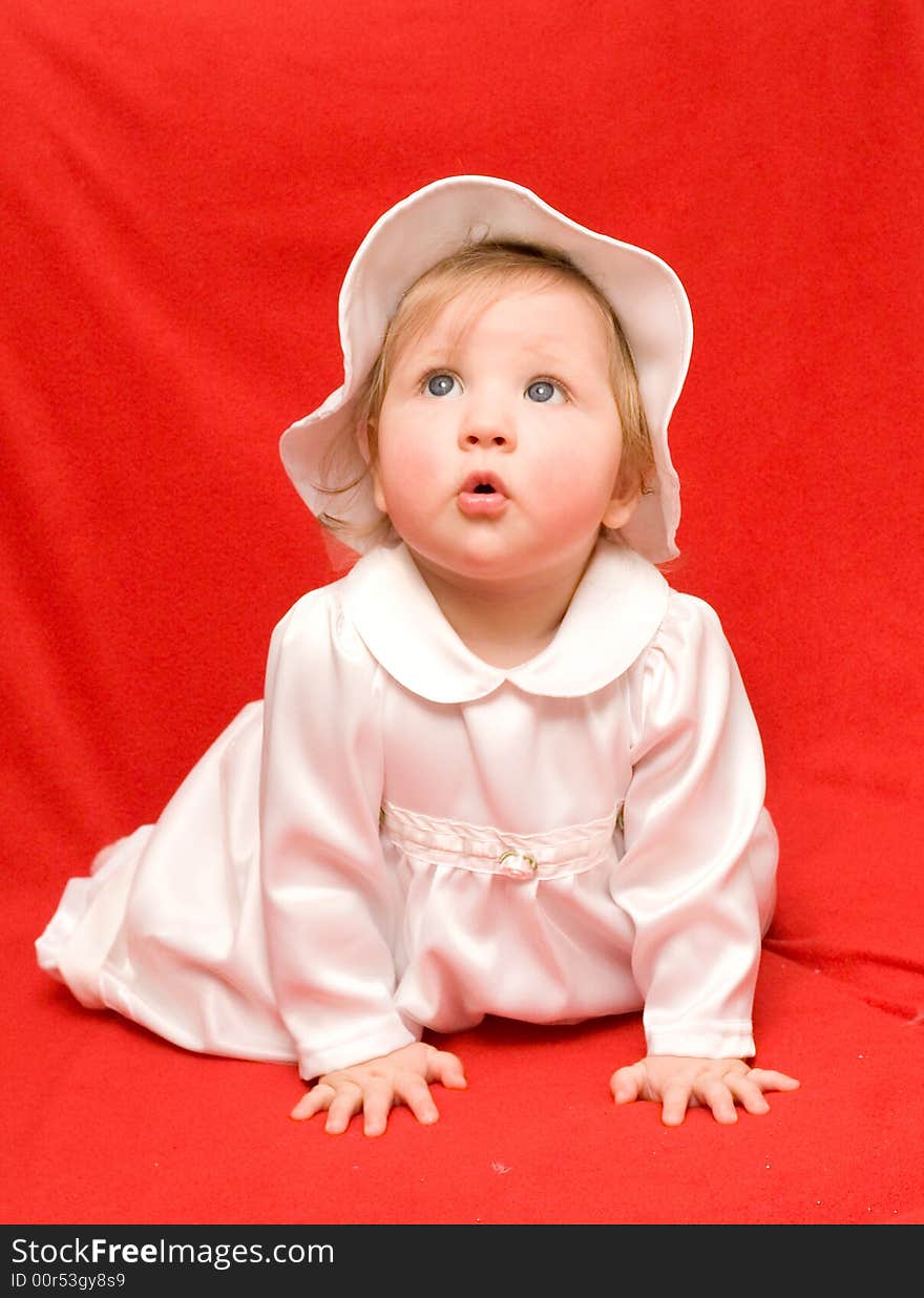 Girl in white clothes on a red background