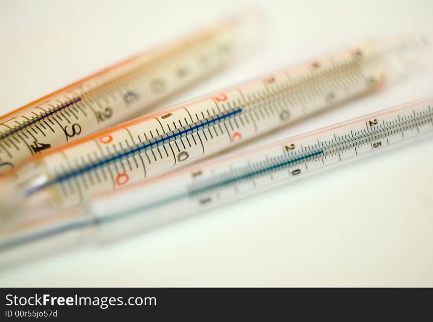 Group of three photographic thermometers.