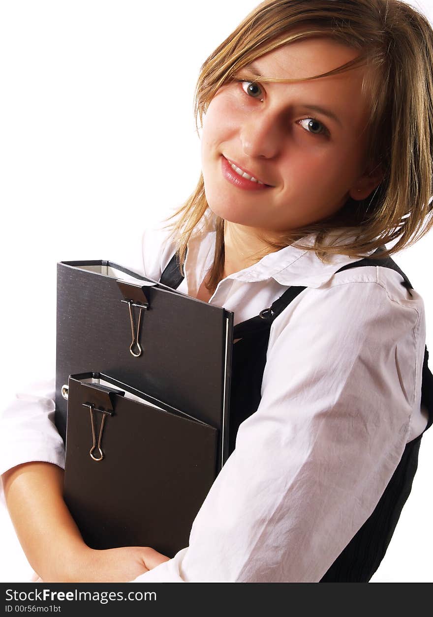 Young businesswoman at work, holding folders