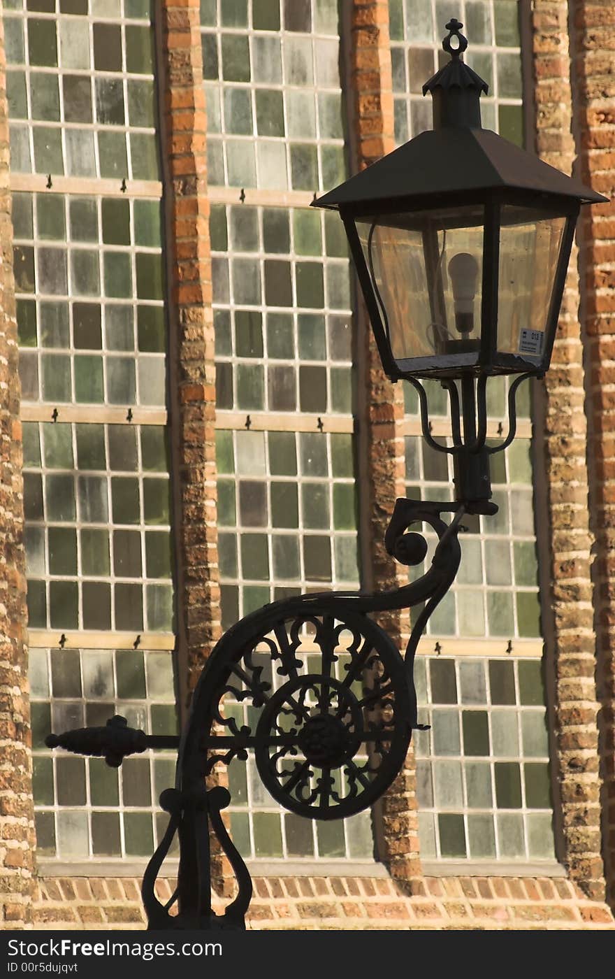 Old black metal lantern, detail taken at the location in Delft - by the church. Old black metal lantern, detail taken at the location in Delft - by the church