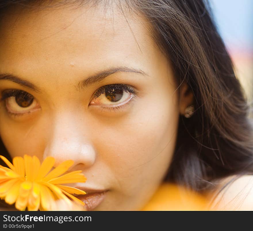 Portrait of l woman with flower