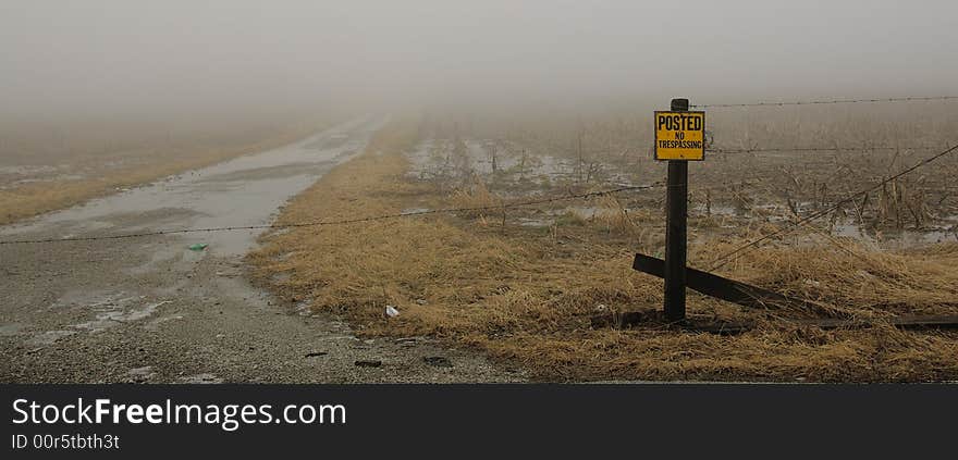 A sign forbidding passage to an unknown road. A sign forbidding passage to an unknown road.