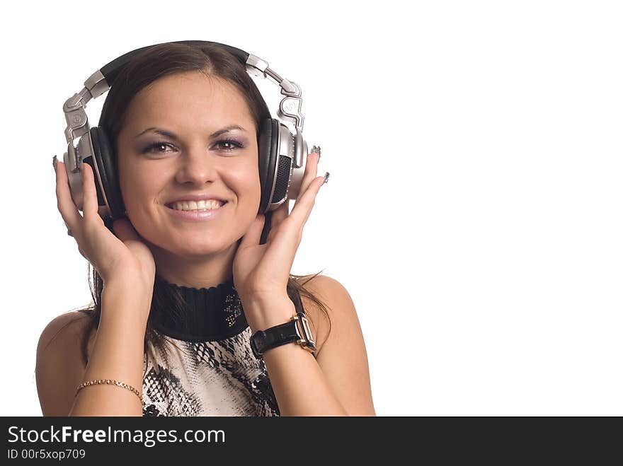 The beautiful girl with headphones on a white background. The beautiful girl with headphones on a white background