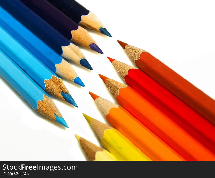 Rows of varicoloured wooden pencils