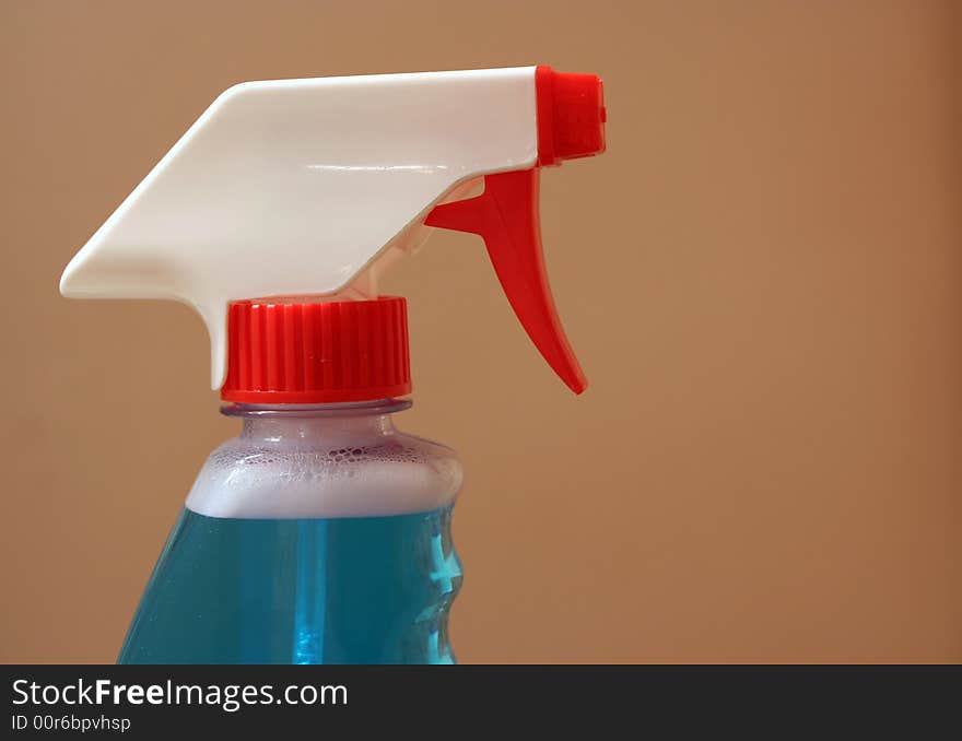 A Spray bottle on beige background