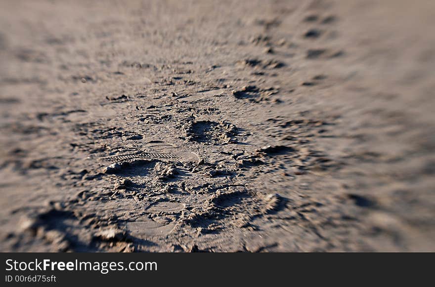 Footprints of sand with minimal DoF. Taken using a lensbaby lense. Footprints of sand with minimal DoF. Taken using a lensbaby lense.