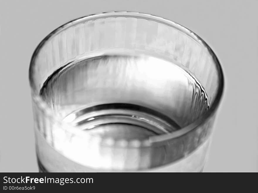 Single glass of water black and white macro