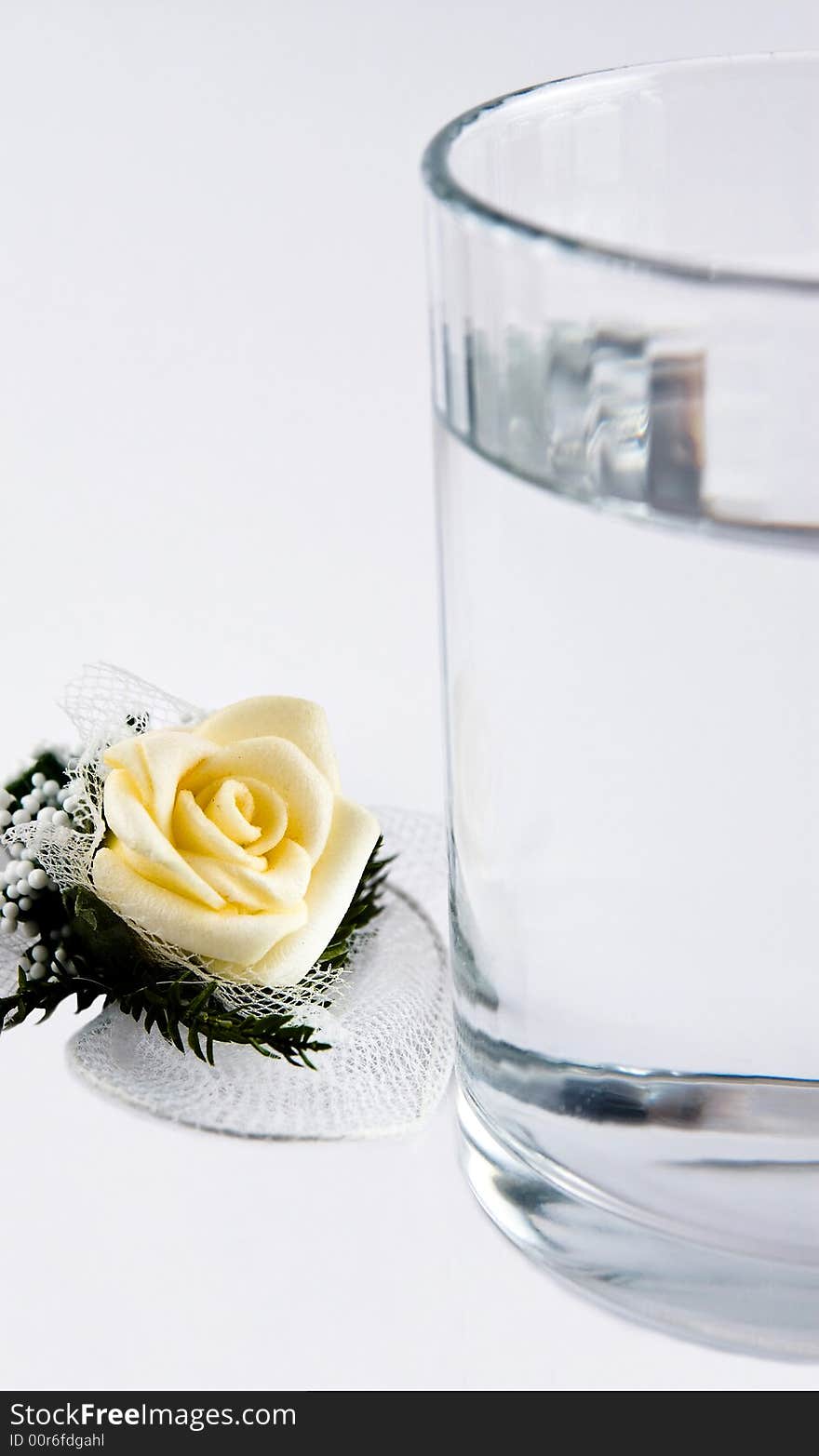 Rose And A Glass Of Water