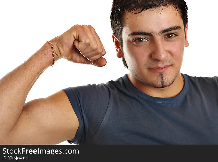 A bronze man is demonstrating his biceps.