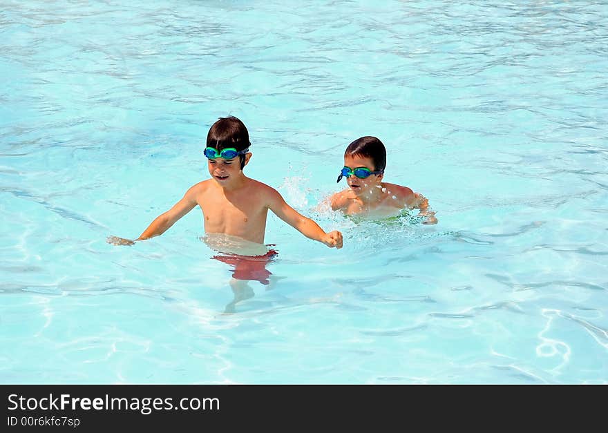 Boys Playing In The Pool