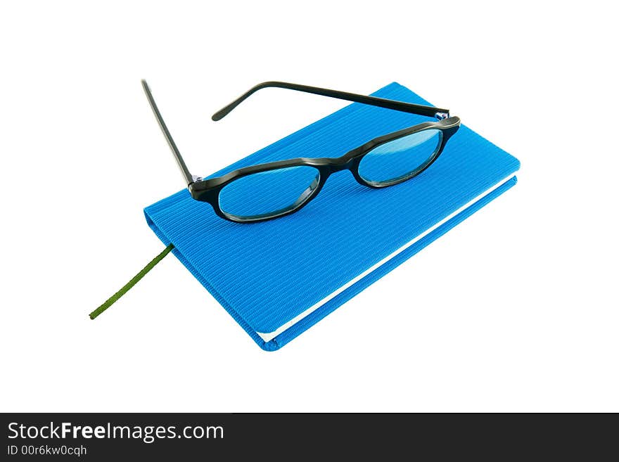 Blue calendar and black glasses. Blue calendar and black glasses