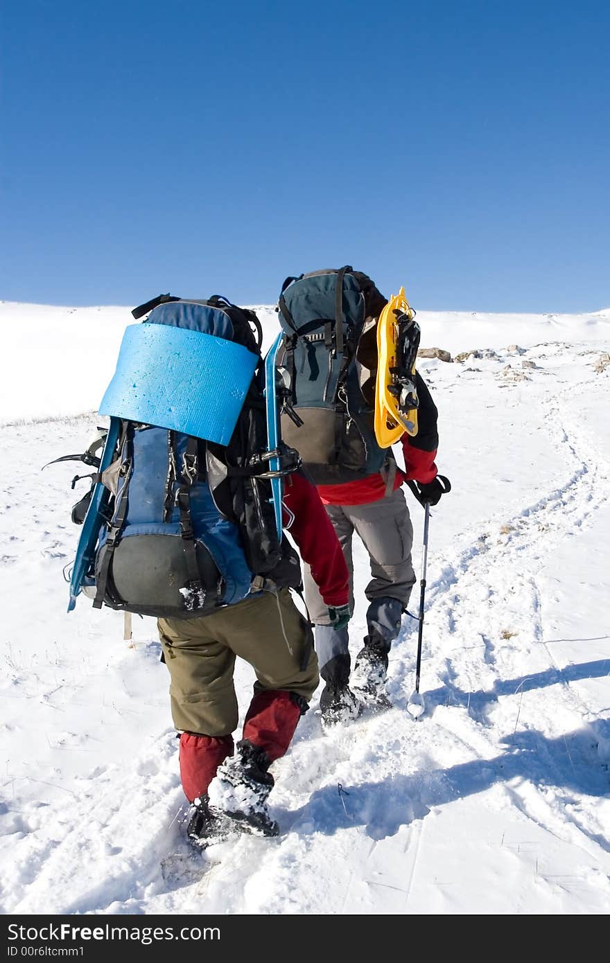 Tourists are in winter in mountains