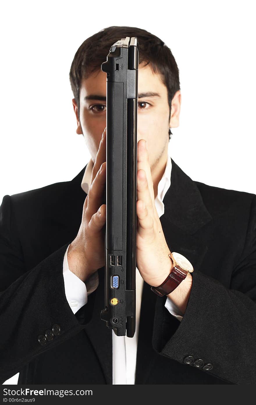 Businessman holding the laptop in front of his face. Businessman holding the laptop in front of his face