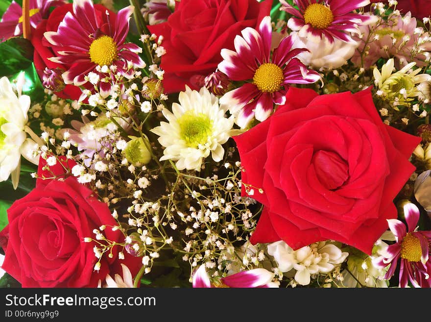 Colorful flower background with roses and chrysanthemums