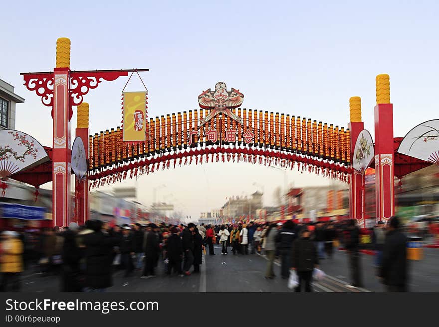 Scene of the street at the temple fair of Beijing.Chinese on the colored gate of the temple fair is temple fair of Beijing