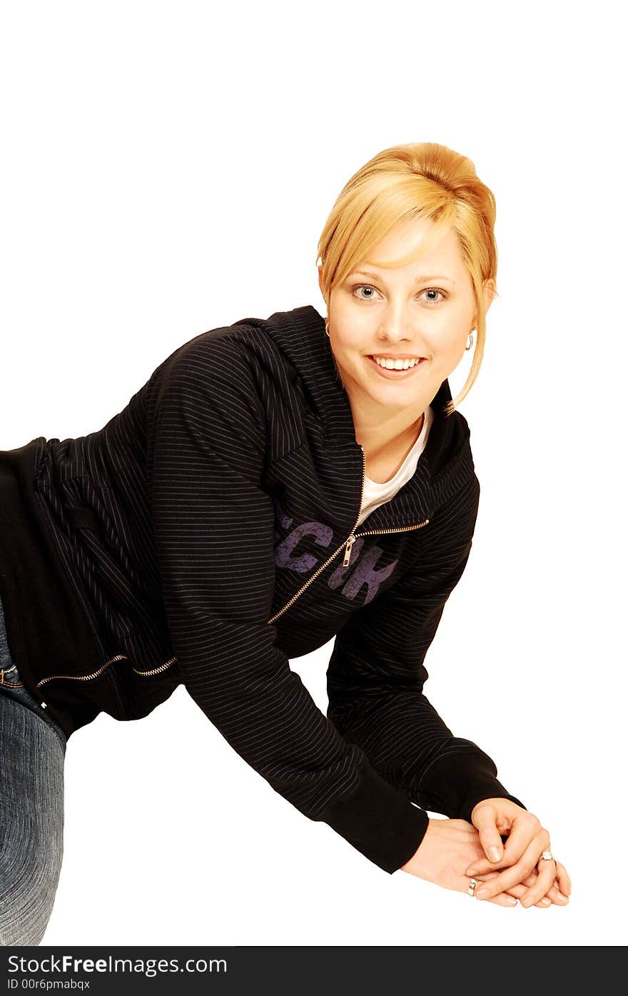 A single pretty girl, sitting on the floor over white background 
in jeans and an black sweater. A single pretty girl, sitting on the floor over white background 
in jeans and an black sweater.