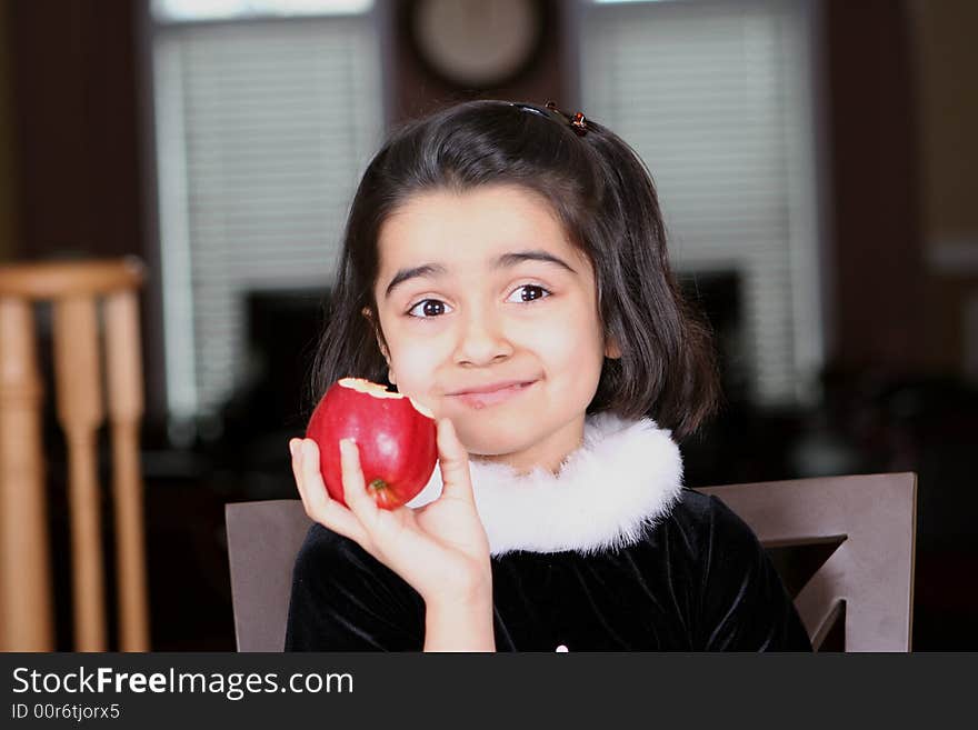 Sweet and cute girl eating apple. Sweet and cute girl eating apple