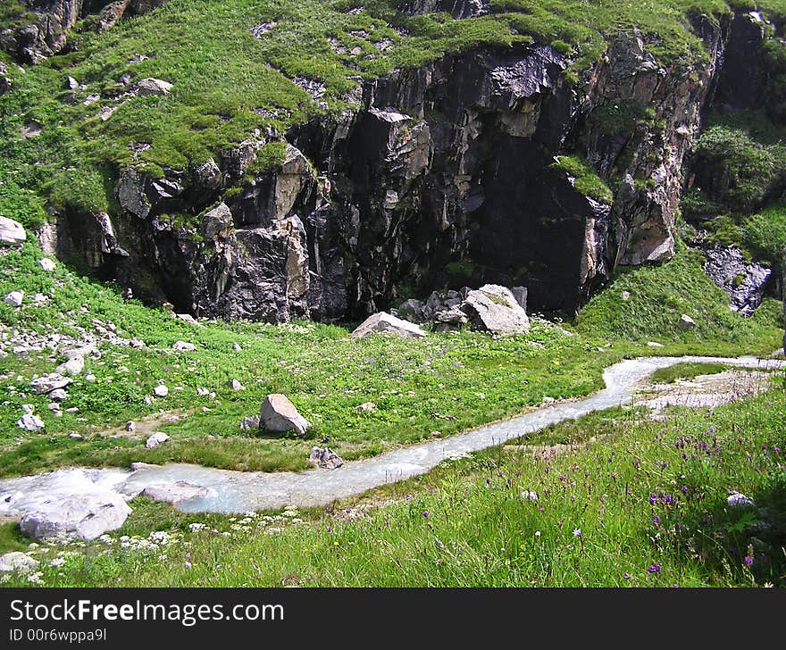 Rocks And Mountain River