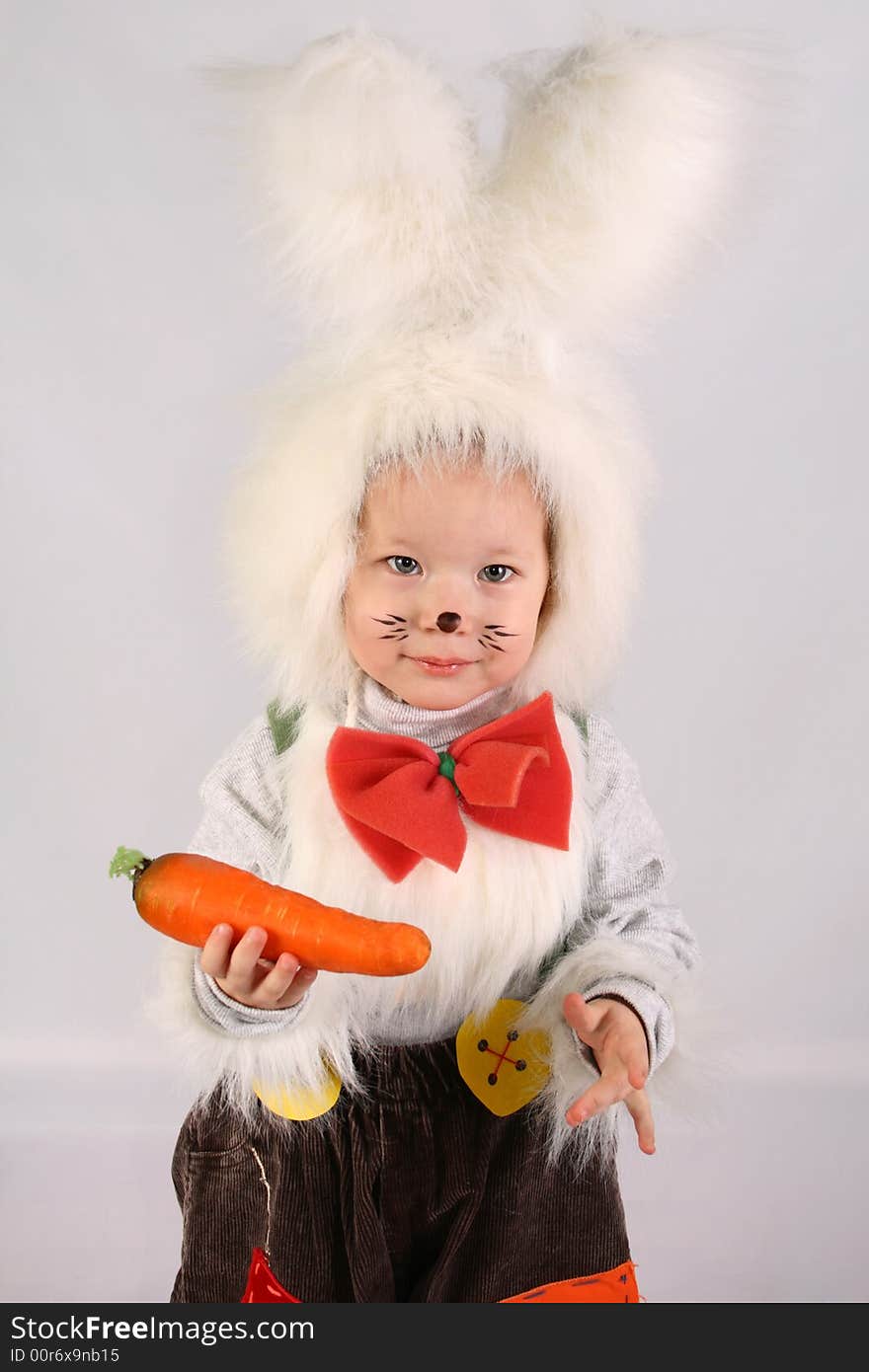 Girl in a white downy bunny costume. Girl in a white downy bunny costume.