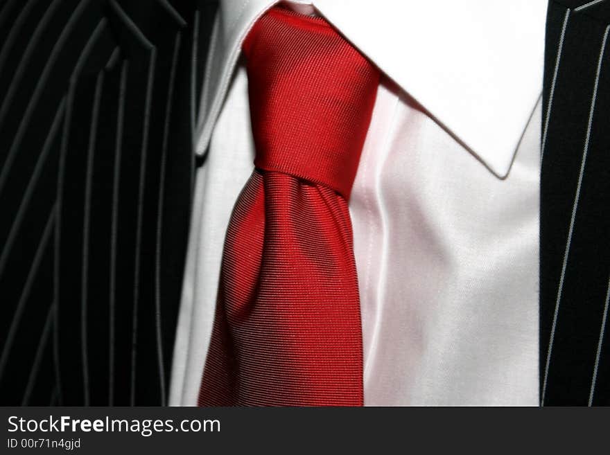 BRIDEGROOM TUX with red tie close up. BRIDEGROOM TUX with red tie close up