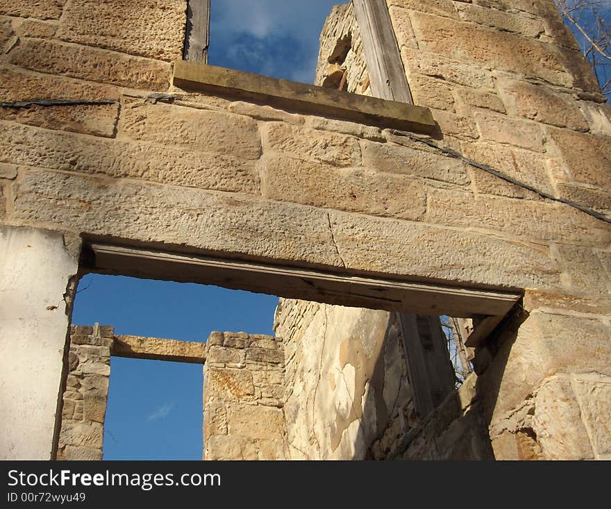 Ruins of an old stone house against a clear blue sky. Ruins of an old stone house against a clear blue sky