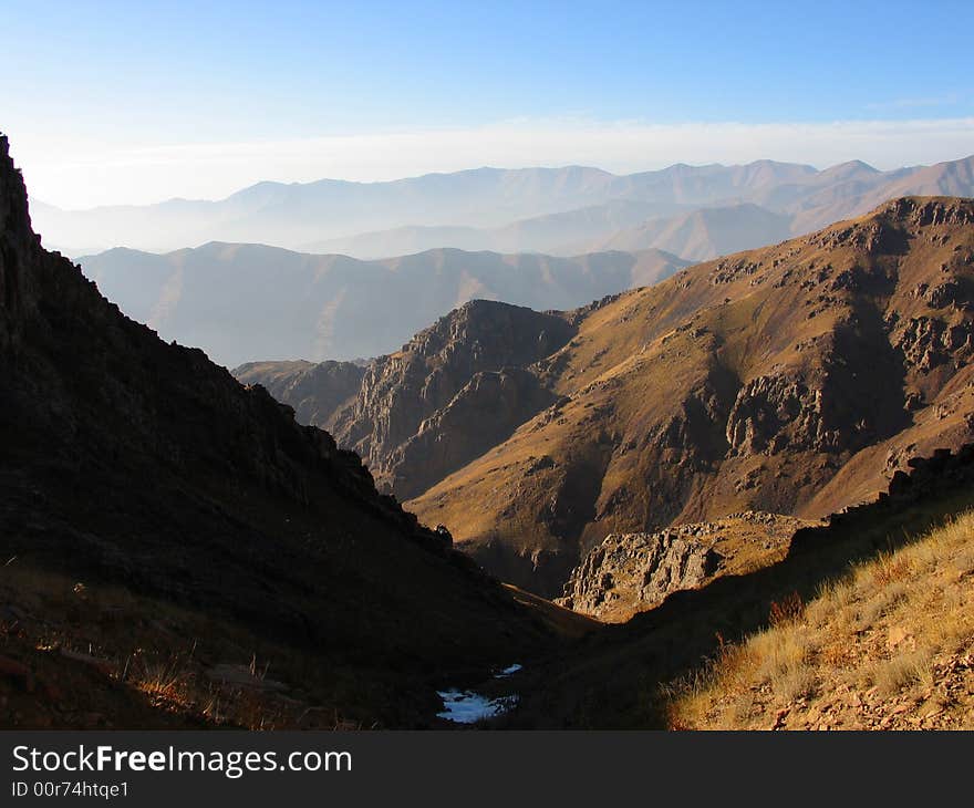 Dark and light slopes on mouantain range background. Dark and light slopes on mouantain range background