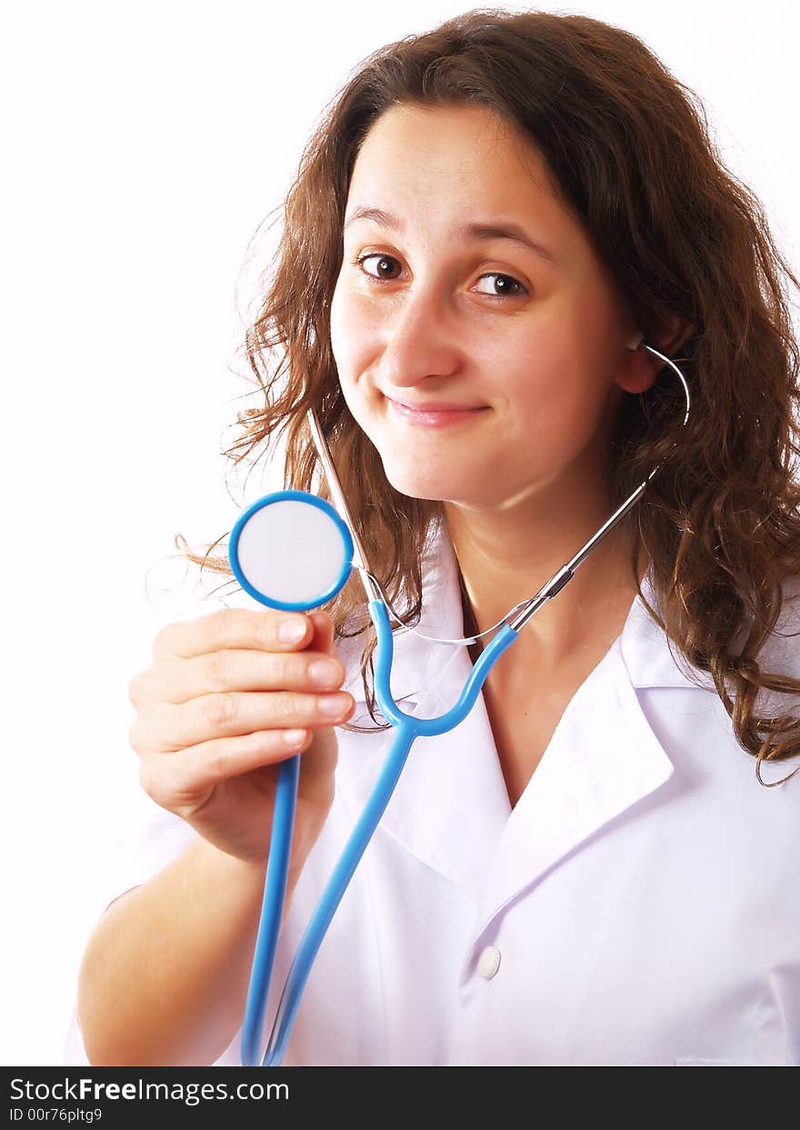 Female doctor holding a stethoscope and smiling. Female doctor holding a stethoscope and smiling