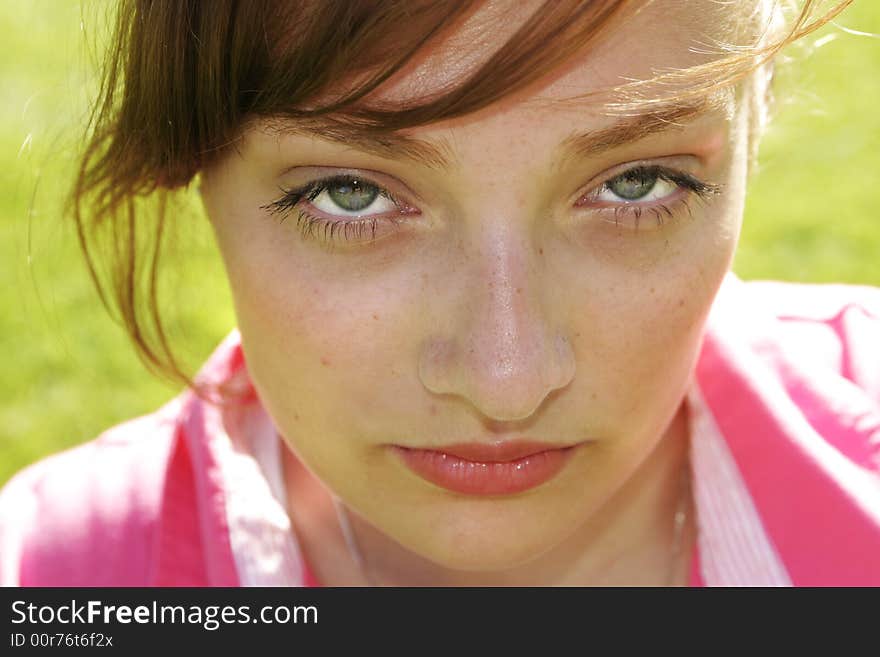 Closeup of teenage girl in pink shirt. Closeup of teenage girl in pink shirt