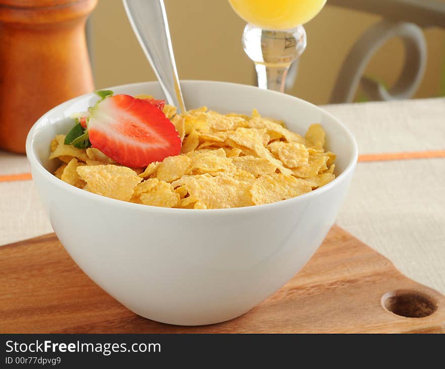 Bowl of crunch corn flakes with strawberries. Bowl of crunch corn flakes with strawberries.