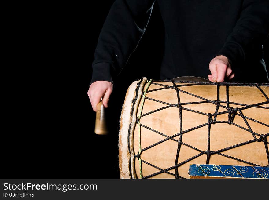 One musician playing drums in a studio. One musician playing drums in a studio