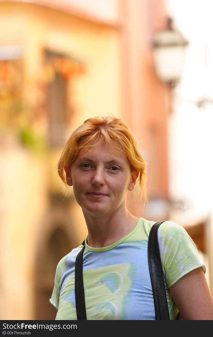 Pretty red-headed girl on street