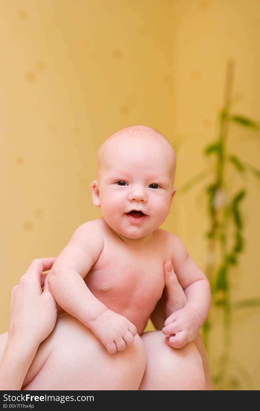 Mother holding baby on laps