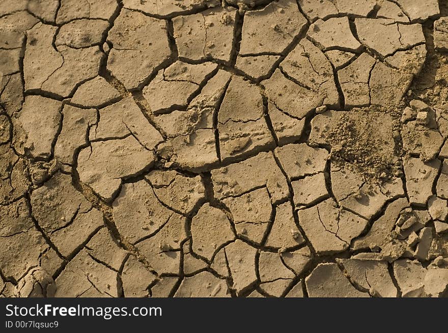 Detail of dried soil with cracked surface. Detail of dried soil with cracked surface