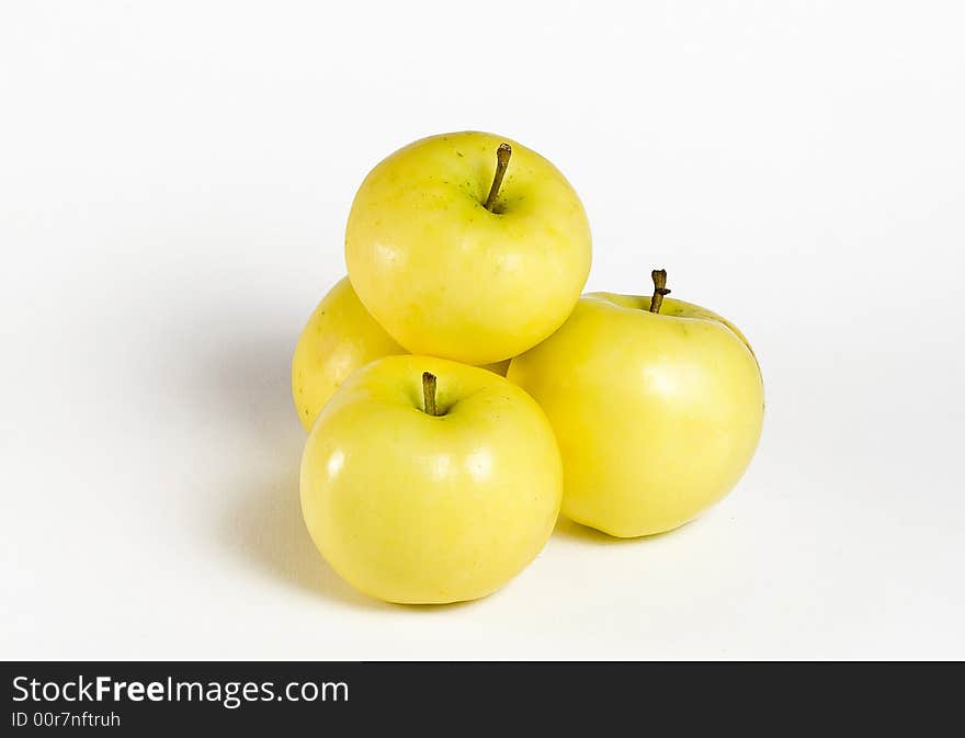 Fresh yellow apples on the white background. Fresh yellow apples on the white background