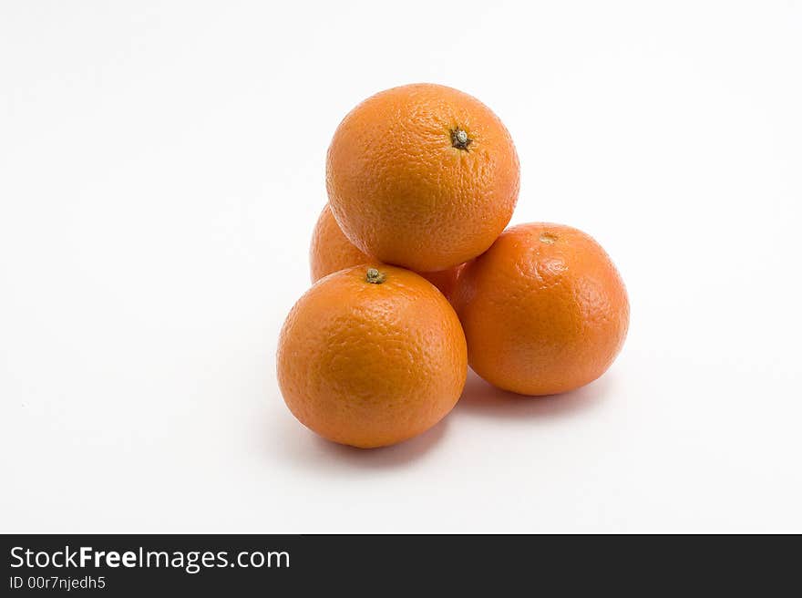 Four fresh and sweet mandarines over white background. Four fresh and sweet mandarines over white background