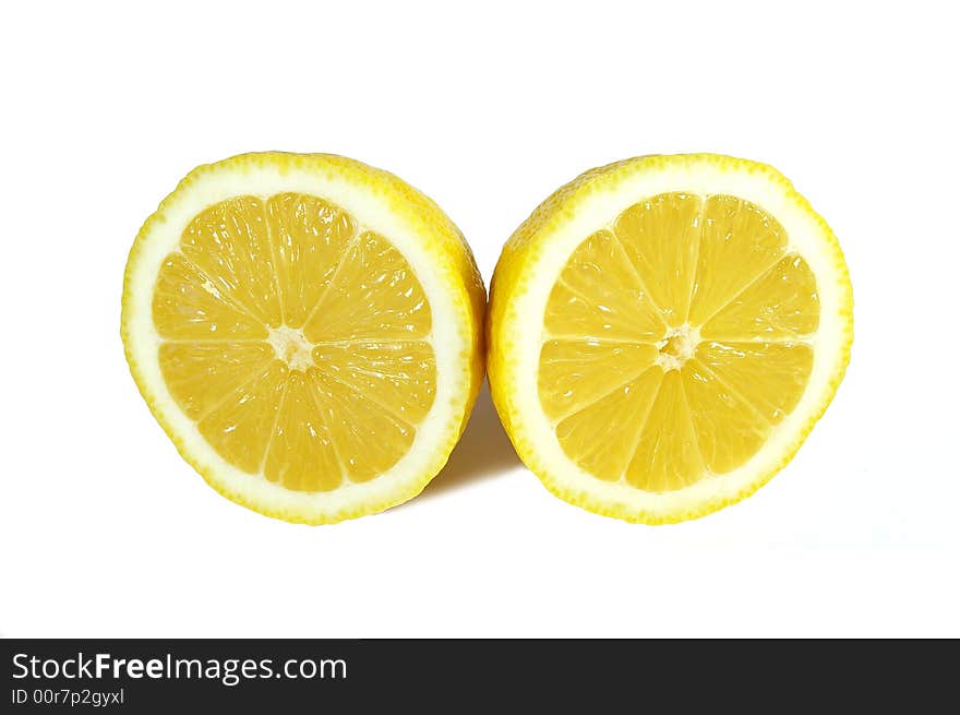 Two halfs of yellow ripe lemon on white background. Two halfs of yellow ripe lemon on white background