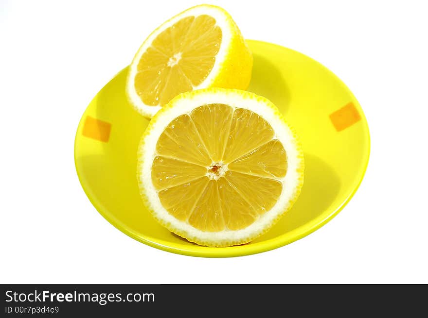 Two halfs of yellow ripe lemon on white background