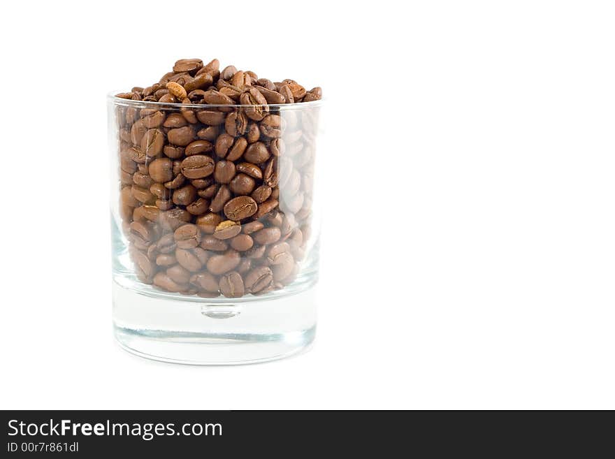 Transparent glass with coffee-beans isolated on white