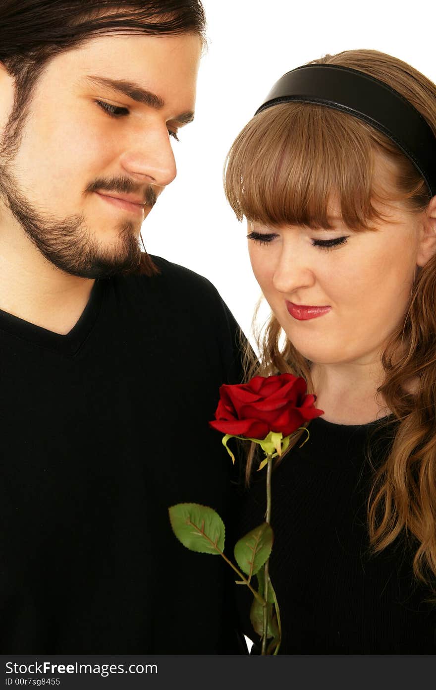 Romantic couple sharing love or romance symbolize with red rose. Romantic couple sharing love or romance symbolize with red rose