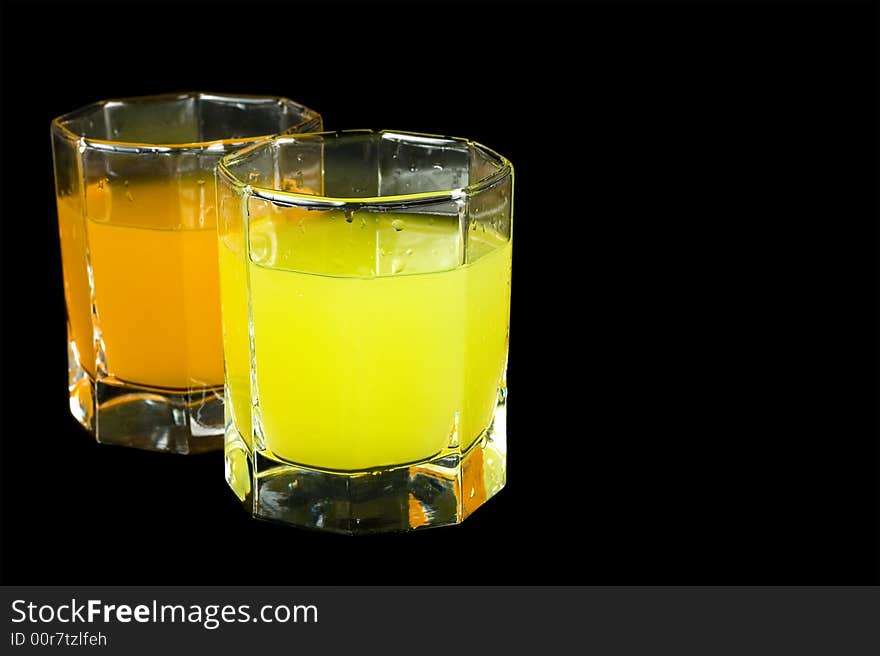 Two glass with colored liquid