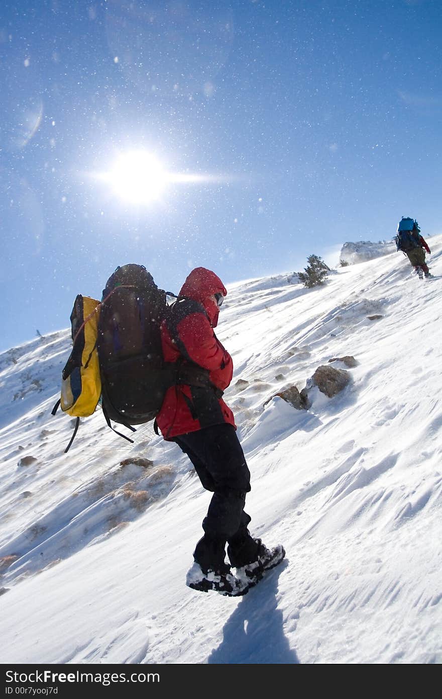 Tourists are in winter in mountains