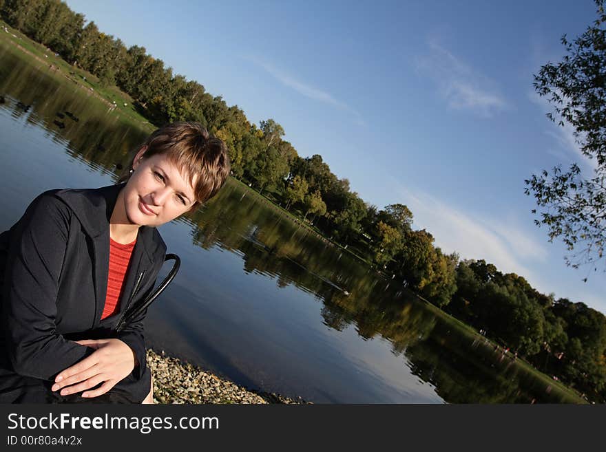 The woman in the lake side in spring. The woman in the lake side in spring