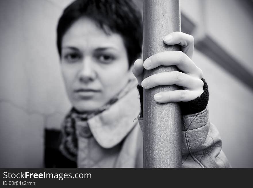 A view with a woman looking  thoughtful in black and white tones.