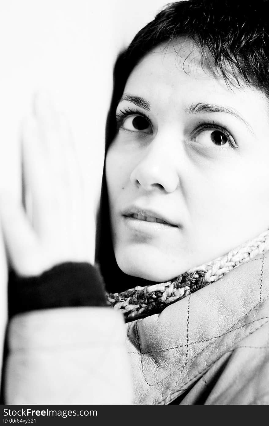 A view with a woman looking up thoughtful in black and white tones.